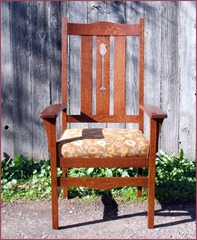 Lighter arm chair in fabric.